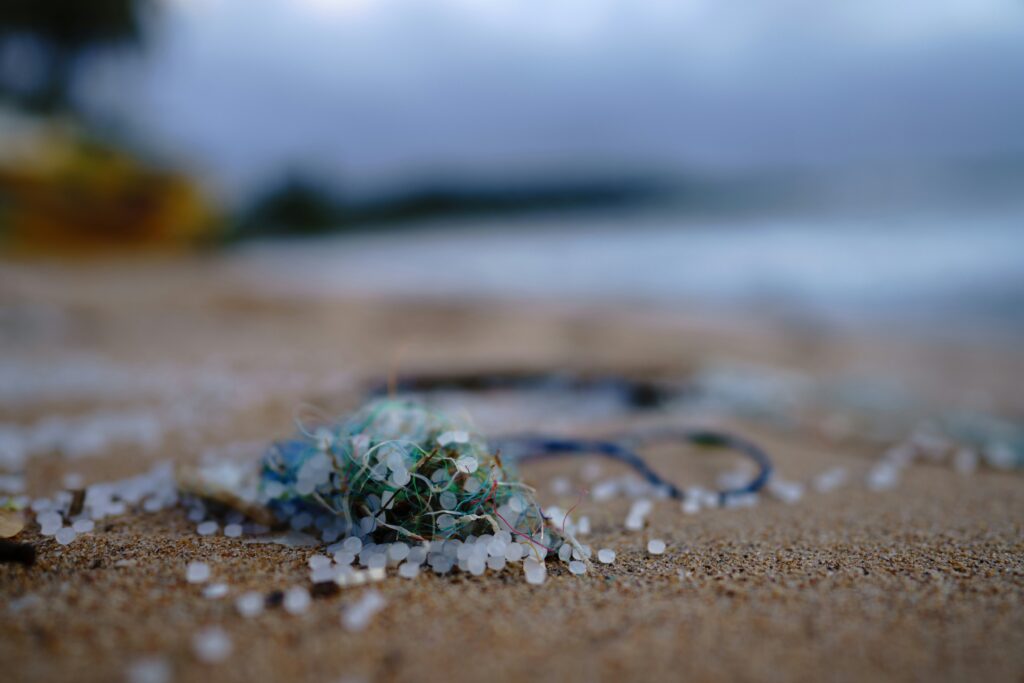 Microplastics on a sandy beach due to rPET production. 